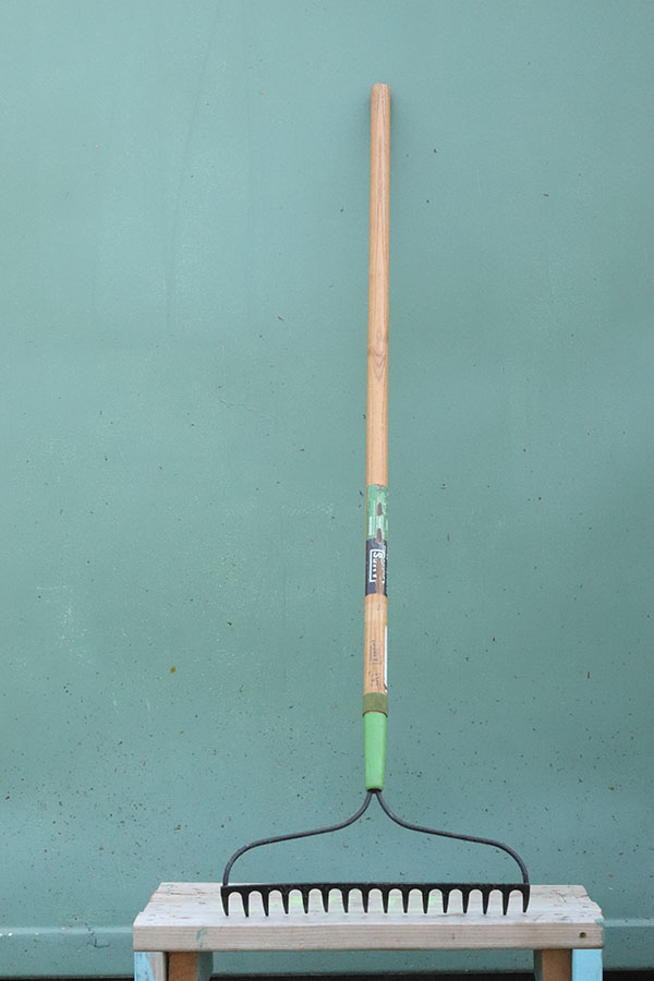 A garden rake has hard metal tines.