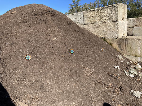 Three Compost Thermometers Monitoring Compost Pile Status