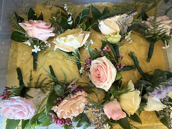 Rose Corsages Ready for the Wedding Party