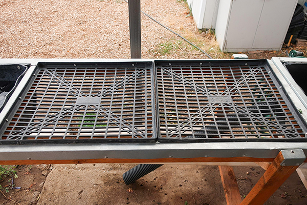 Spray table for washing root crops.