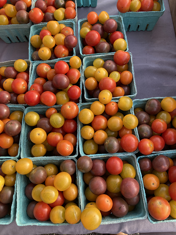 Colorful Cherry Tomatoes in Pint Boxes at Market